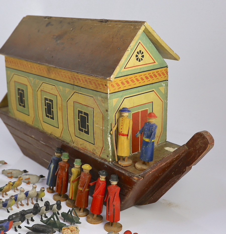 A late 19th century German painted wood Noah's Ark with 136 assorted figures and animals, 14cm wide, 54cm long, 30cm high, largest figure 8cm